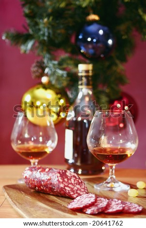 http://image.shutterstock.com/display_pic_with_logo/97394/97394,1226880604,6/stock-photo-bottle-of-cognac-two-glasses-and-sausage-on-a-new-year-s-background-20641762.jpg
