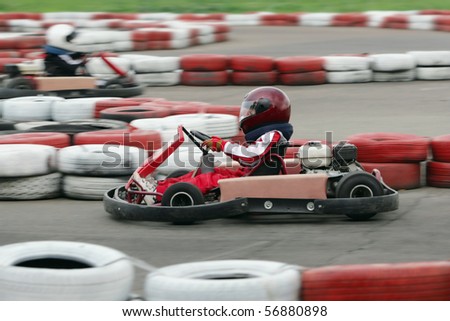 Young go cart race on circuit