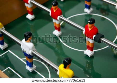 Football  players on the grass field background. Board game.