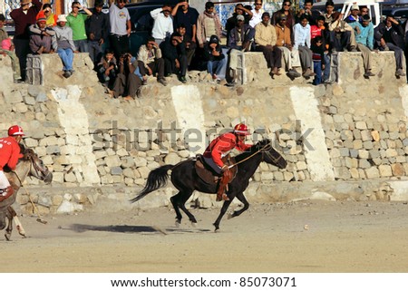LEH,  LADAKH - SEPTEMBER 3: An unidentified polo player charge after the ball at a match in Leh\'s polo grounds on September 3, 2011, in Leh, Ladakh.