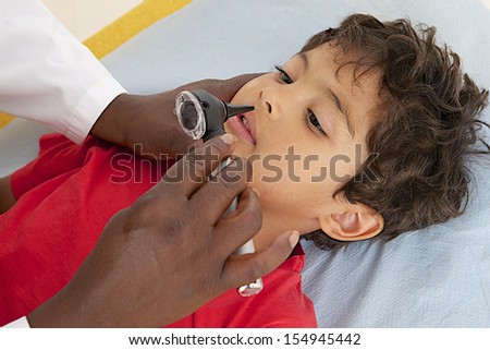 medical visit - young boy- examination of the nose,