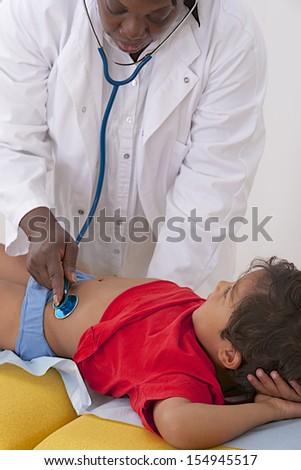 medical visit - young boy- examination of the abdomen,