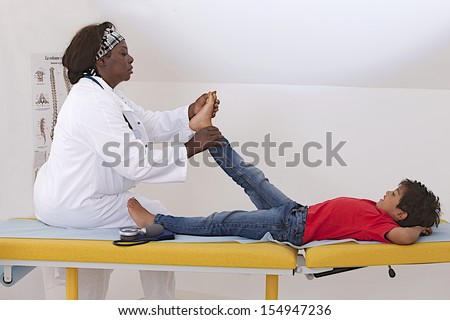 medical visit - young boy- Examination of the lower limbs