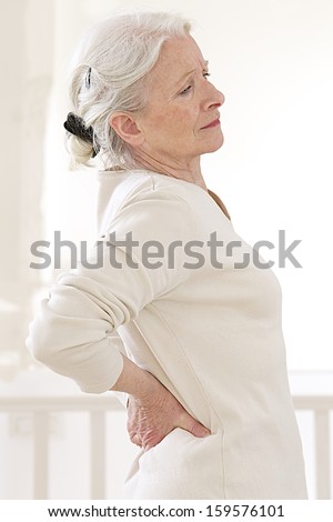 senior woman suffers from backache. - Mature female has pain in back