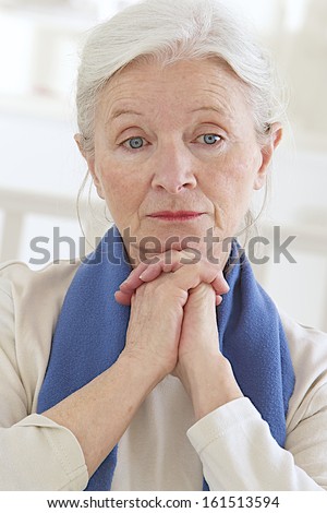 Sad and thoughtful old lady