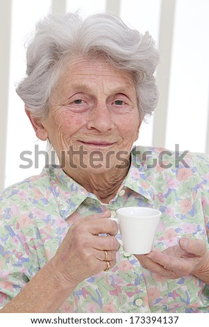 Senior woman enjoying cup of tea at home