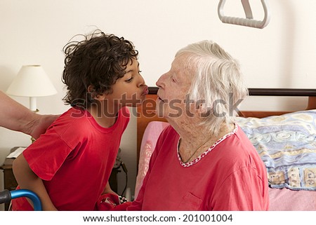 grand son embracing grandmother   home hospitalized
