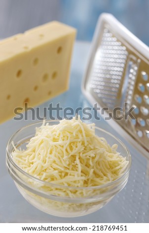 piece of cheese and grated cheese