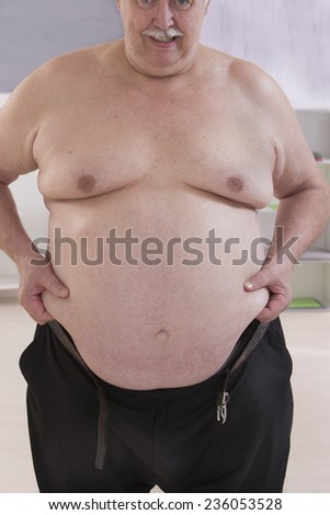 fat man touching his stomach