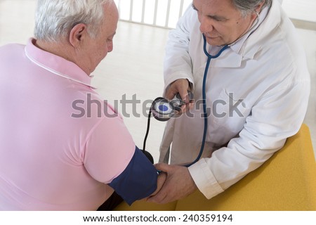 Doctor checking blood pressure of his patient  fat man