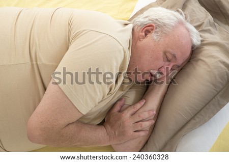 Close up of senior man sleeping and Snoring in bed