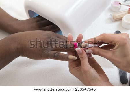 - Woman getting artificial nails done, selective focus