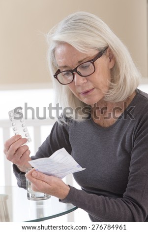 Senior woman reading medical information