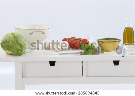 healthy foods are on the table in the kitchen on white background