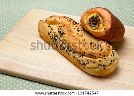Sesame bread and sweet potato bread with chopping block