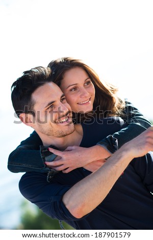 happy young couple on holiday by the sea in summertime