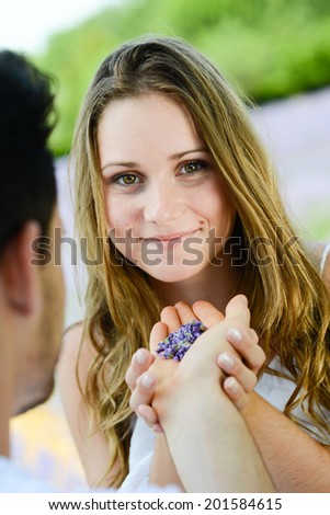 romantic young couple man woman in summer holiday having fun lavender field provence south France