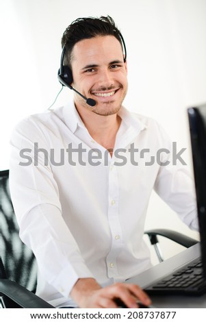 handsome young male telephone customer support hotline service talking on the phone with client
