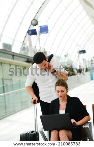 business people man and woman sitting in public station and working with computer in public wifi area