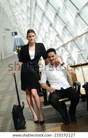 beautiful young business people man and woman waiting in a public transportation station
