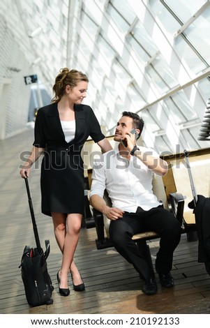 beautiful young business people man and woman waiting in a public transportation station