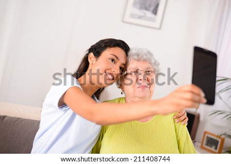 two generation multi-ethnic womans making a funny selfie together