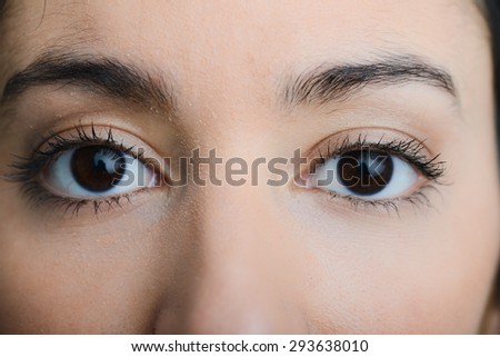 eyes close-up of a beautiful young ethnic woman with dark eyes