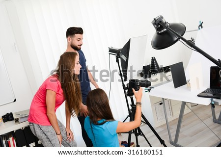 group of young photographer student on photography shooting workshop course indoor in a photo studio