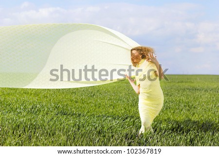 Expressive gorgeous young woman wrapped in yellow cloth