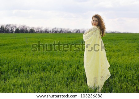 Nice young woman wrapped in yellow cloth