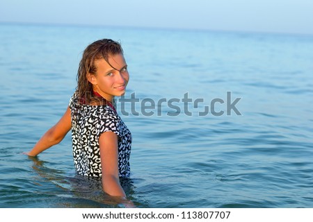 Portrait of a nice teen girl in wet dress