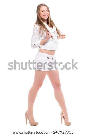 Laughing blond woman posing in white clothes. Isolated on white