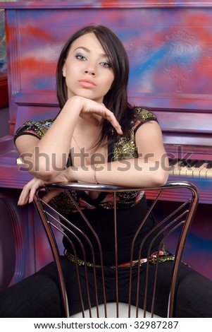 Lovely young woman sitting on a chair