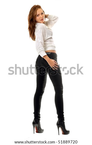 stock photo : Beautiful girl in black tight jeans. Isolated on white