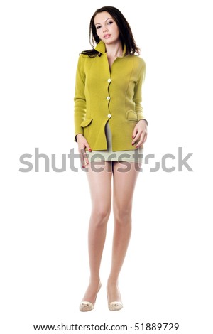 Young pretty woman in yellow knitted jacket. Isolated
