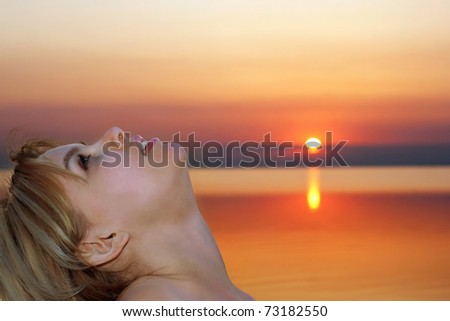 Portrait of a pretty young blonde at sunset