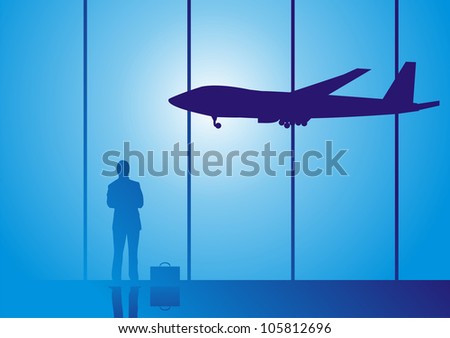 Silhouettes of young man standing against window at airport