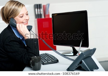 Female secretary answering bosses call and informing updates