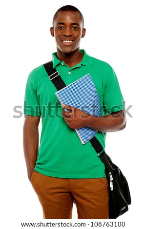 Its study time. Young african student carrying laptop bag and notebook
