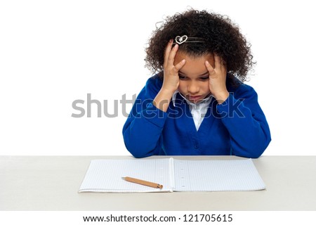 Stressed out primary girl child thinking hard to recollect the answer