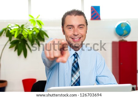 You, yes you! Great job done. Manager seated at his workstation pointing at you.
