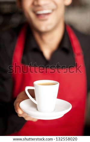 Cheerful Shop Owner Serving Freshly Brewed Coffee To You.