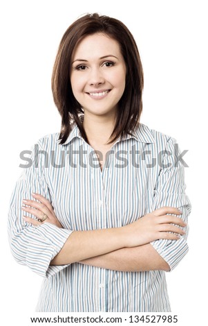 Attractive young female with a radiant smile arms crossed Attractive young female with a radiant smile arms crossed