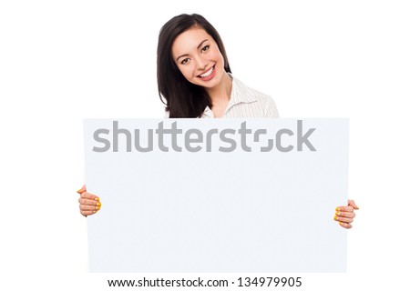 Pretty young asian girl holding blank banner ad, business concept.