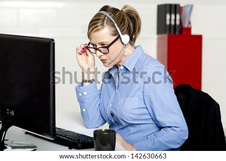 Help desk lady looking into the report closely