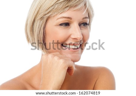Adorable middle aged lady looking away