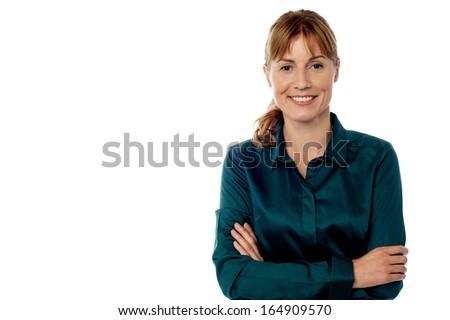 Middle aged woman posing with arms crossed