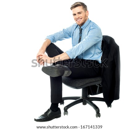 Young manager sitting on revolving chair