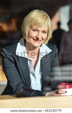 Pretty corporate woman at an outdoor restaurant