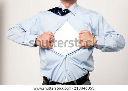 Cropped image of male executive tearing his shirt off